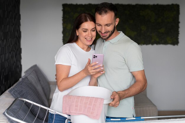 couple doing the laundry together at home