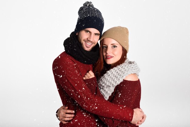 Couple dressed in red hugging