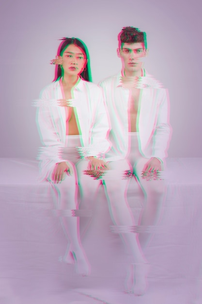 Couple dressed in white clothes with glitch effect