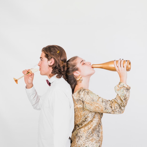 Couple drinking champagne at party