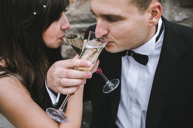 Couple drinking champagne on wedding