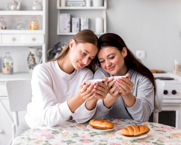 Couple drinking coffee at the table