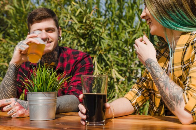 Couple drinking craft beer outdoors