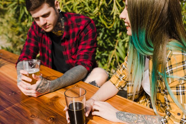 Couple drinking craft beer outdoors