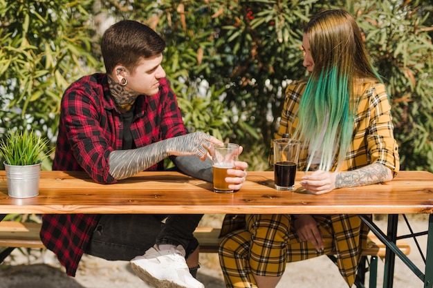 Couple drinking craft beer outdoors