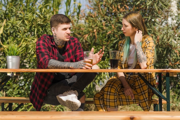 Couple drinking craft beer outdoors