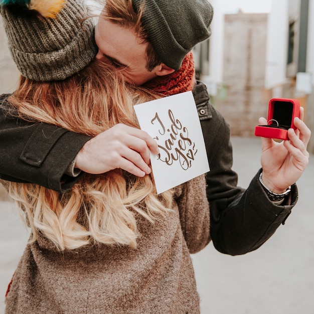 Couple embracing after proposal