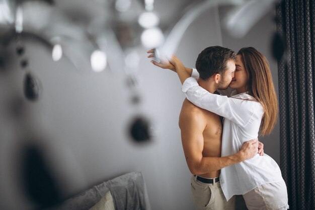 Couple embracing at home