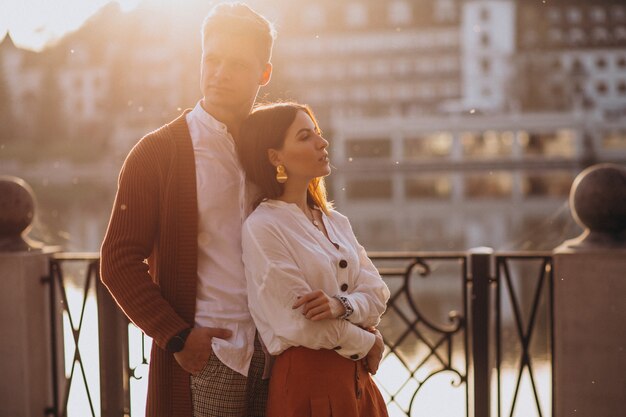 Couple embracing outside by the river