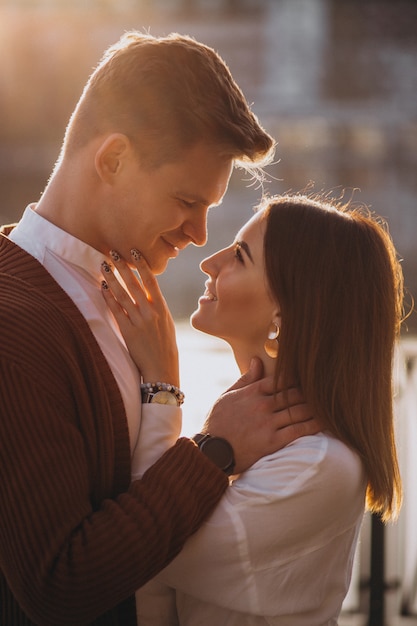 Couple embracing outside by the river