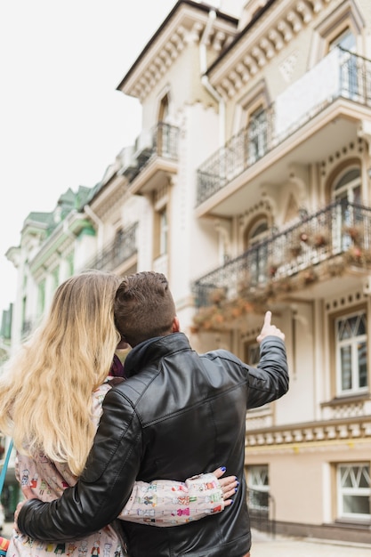 Couple embracing and sightseeing