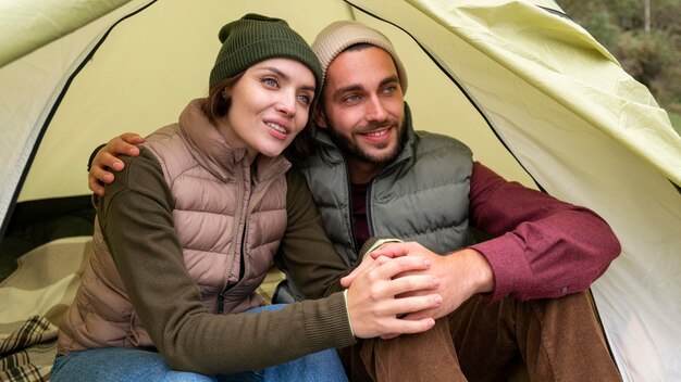 Couple embracing in tent