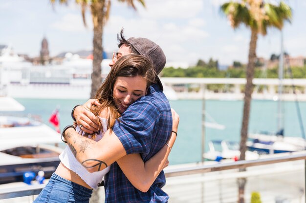 Couple embracing on waterfront