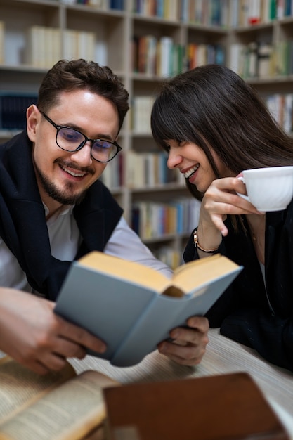 Free photo couple enjoying a bookstore date