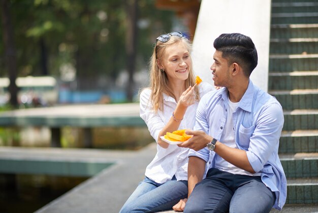 Couple enjoying papaya