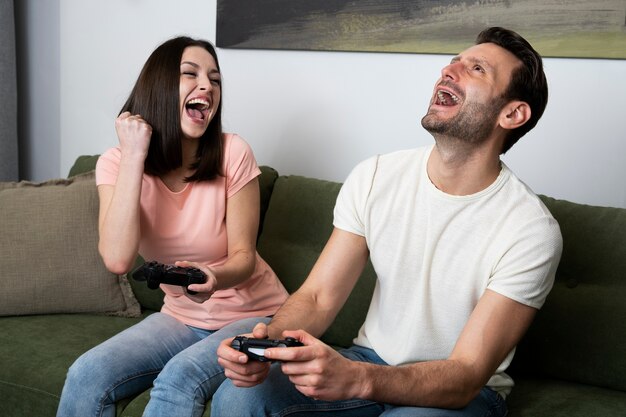 Couple enjoying playing video game