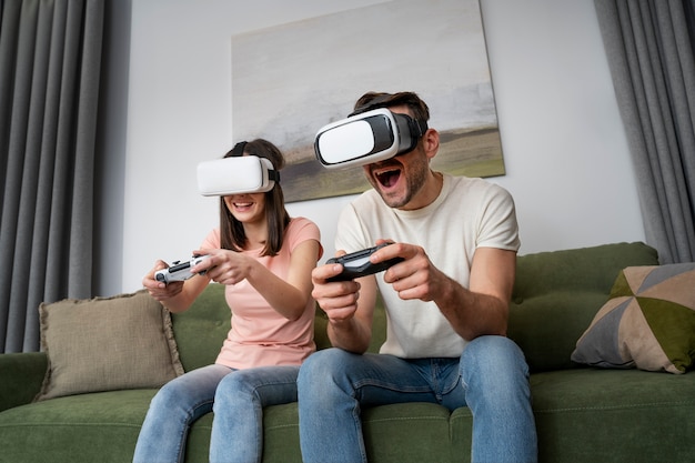 Free photo couple enjoying playing video game