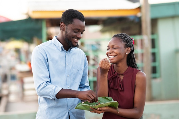 Couple enjoying some street food together