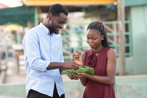 Couple enjoying some street food together