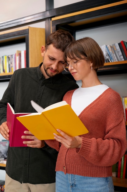 Free photo couple enjoying their bookstore date