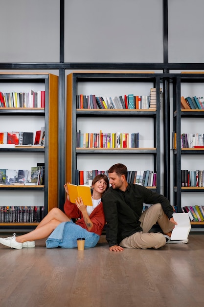 Free photo couple enjoying their bookstore date