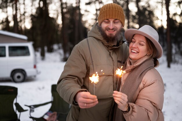 Free photo couple enjoying their winter camp