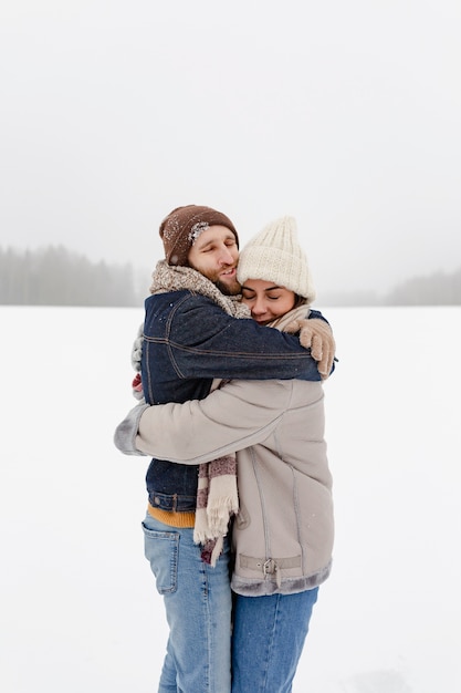 Free photo couple enjoying winter activities in the snow