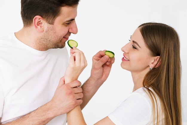 Free photo couple feeding eachother