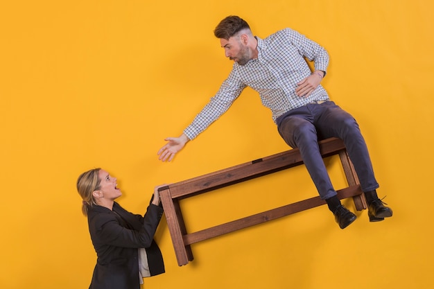 Free photo couple floating on a bench