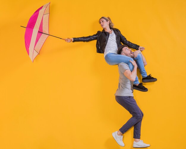 Couple floating with an umbrella