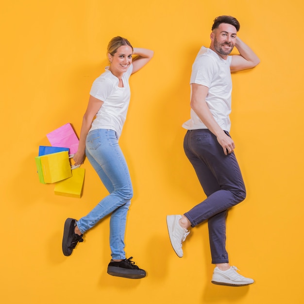 Couple flying with shopping bags