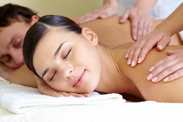 Couple getting back massages