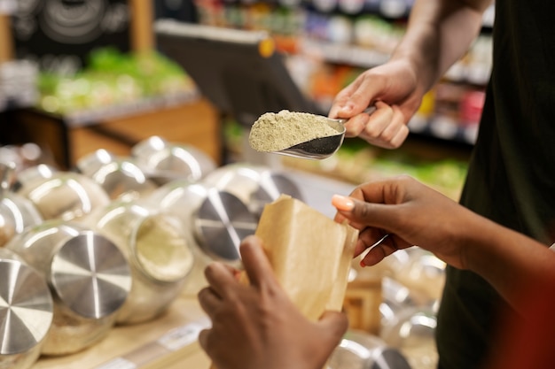 Couple getting spices at the supermarket