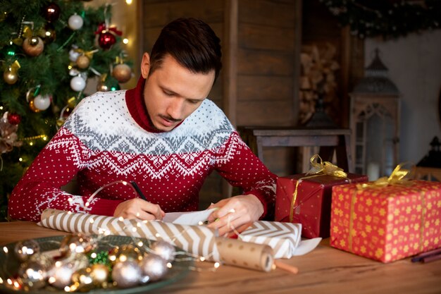 Free photo couple giving each other christmas gifts