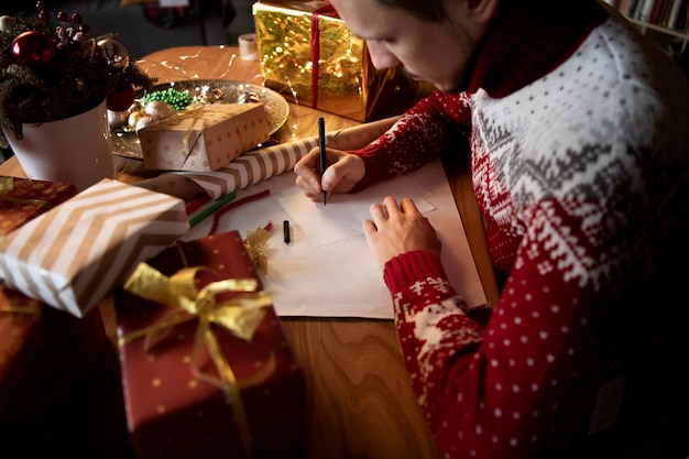 Free photo couple giving each other christmas gifts