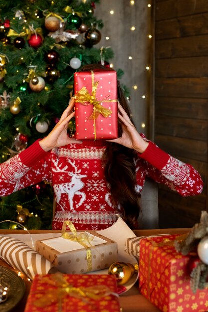 Couple giving each other christmas gifts