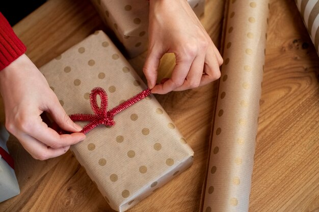 Free photo couple giving each other christmas gifts