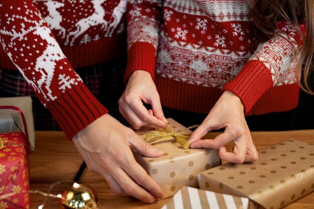 Couple giving each other christmas gifts