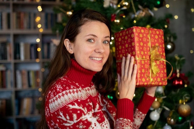 Free photo couple giving each other christmas gifts