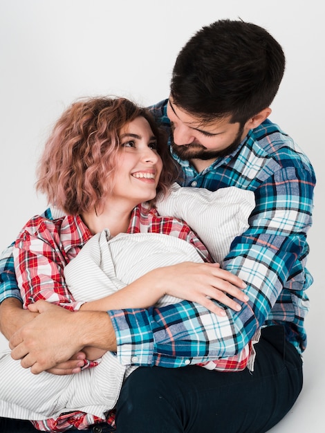 Free photo couple happily embraced for valentines