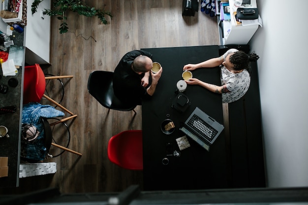 Free photo couple having breakfast seen from above