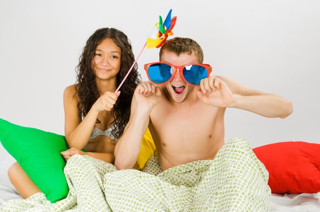 Couple having fun at the bed