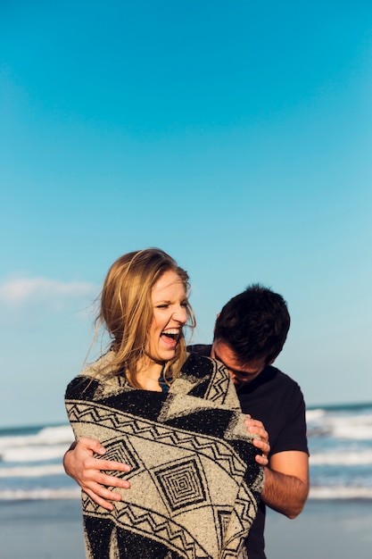 Free photo couple having fun near sea