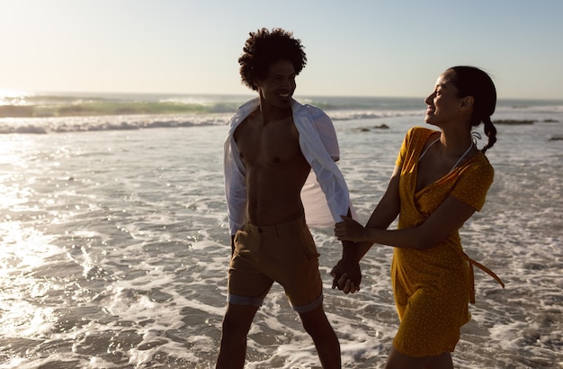 Couple having fun together on the beach