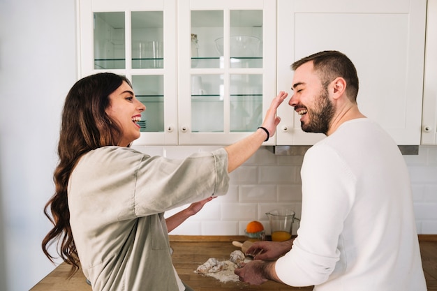 Couple having fun while cooking