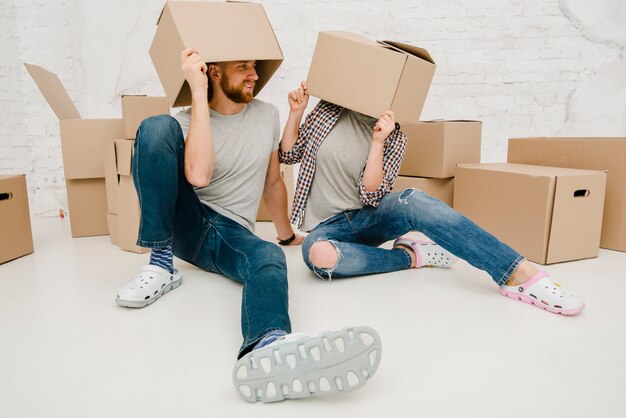 Couple having fun with boxes