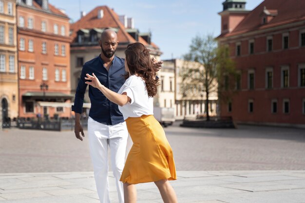 Couple having a latin dance performance in the city