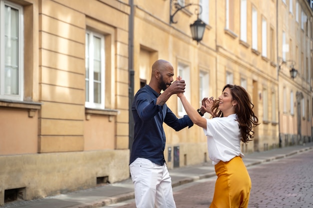 Couple having a latin dance performance in the city