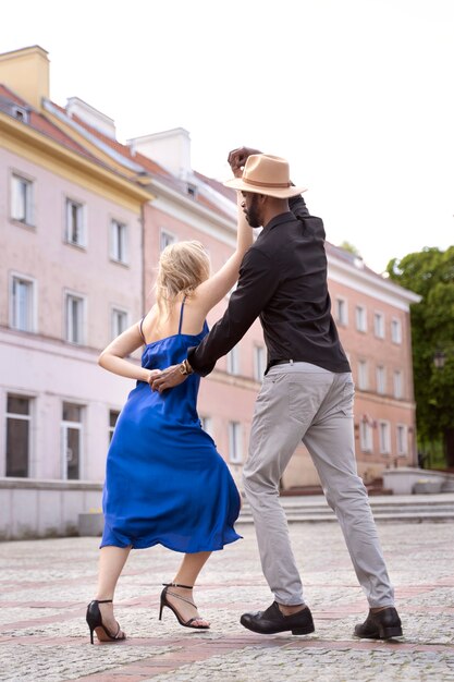 Couple having a latin dance performance in the city