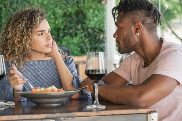 Couple having lunch together at a restaurant.